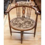 An Edwardian mahogany inlaid bedroom chair with shell inlay