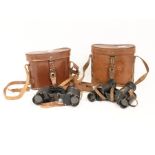 Two pairs of early 20th Century cased binoculars
