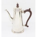 A Georgian style plain tapering coffee pot, fruitwood handle and finial, hallmarked by William