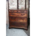 A George III mahogany chest of drawers, fitted with two short drawers and three long graduated