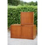 A 1970s teak two door cupboard unit and a matching single door unit (2)