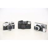 A selection of vintage point and shoot cameras, to include Minolta, Paxette and Fujca II, circa