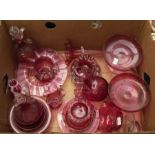 A quantity of late 19th/early 20th century cranberry glassware to include vases, footed bowls etc