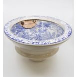 A Victorian Staffordshire blue and white transfer printed oval toilet bowl, circa 1860