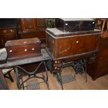 Two early 20th Century treadle sewing machines, cast bodies along with 19th Century writing slope