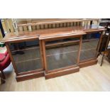 A Victorian style mahogany breakfront bookcase, glazed doors, on raised plinth - 192cm wide x 92cm