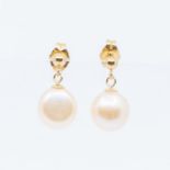 A pair of 9ct gold fresh water pearl drop earrings, pearls approx. 7mm, with bead and peg, post