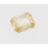An emerald cut moissanite, weighing approx 2.95 carat, pale yellow in colour, size approx 9 x 6mm,