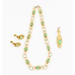 A 14k gold and chrysoprase necklace, comprising pierced links claw set to the centre with a round
