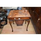 A late 19th Century sewing table with 20th Century legs