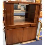 A 1960s tambour-fronted cocktail bar with two cupboard doors to base, a pull out cocktail shelf