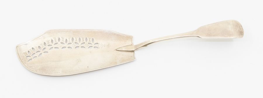 A George III silver fiddle pattern fish slice, the blade bright cut engraved and oval openwork