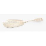 A George III silver fiddle pattern fish slice, the blade bright cut engraved and oval openwork