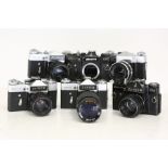 A collection of vintage Zenith cameras to include EM, E, B various lenses (6) Featuring:  Zenit-E