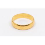 A 22ct gold wedding band, width approx. 5mm, size R, total gross weight approx. 5gms Condition