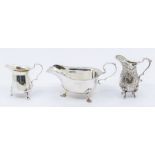 A Victorian silver small cream jug with rusticated chased decoration, import marks London, 1887, 3.