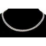 A diamond and 18ct white gold line necklace collar, comprising graduated articulated box links, each