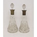Two heavy cut glass 19th century decanters with plated necks.