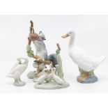 Two Lladro figures of wildlife and two similar figures