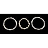 A collection of three fresh water pearl bracelets, each pearl of irregular form, comprising two