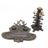 A late 19th Century to early 20th Century bronze Art Nouveau desk inkwell, along with late 19th
