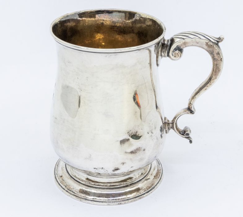 A George III silver plain baluster tankard, S scroll handle with acanthus thumbpiece, hallmarked