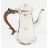 A George II silver small tapering coffee pot, plain body engraved with a crest, fruitwood handle,