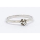 A Danish 18k white gold  and diamond solitaire ring, comprising a flower detail claw set to the