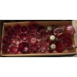 A quantity of late 19th /early 20th century cranberry glassware to include wine glasses, condiments,