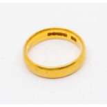 A 22ct yellow gold wedding band, D shaped, width approx. 4mm, weight approx.  4.3gms