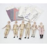 Six dolls with dress making equipment