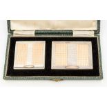 A mid 20th Century silver / parcel gilt vanity set comprising compact and cigarette case, engine