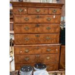 A George I walnut bookmatched chest on chest, circa 1720, the upper section with three short drawers