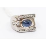 A sapphire and diamond 18ct white gold dress ring, comprising an oval cabochon sapphire approx 8 x