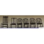 A collection of six chairs, comprising four Windsor type dining chairs, a 1920s Carolean style