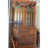 Victorian mahogany dresser, upper section glazed with wooden shelves, lower section with two