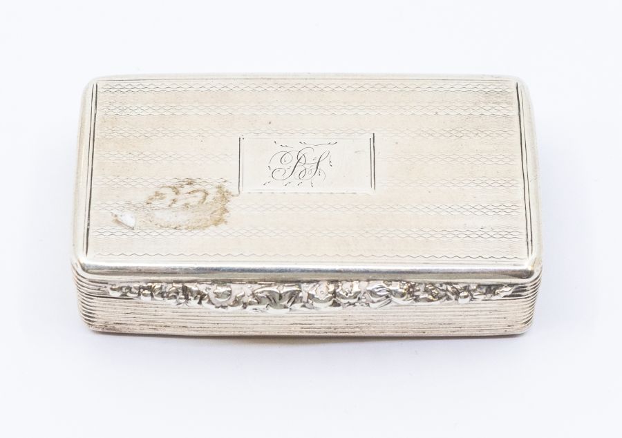 A William IV silver snuff box, reeded sides with foliate thumbpiece, engine turned decoration, the