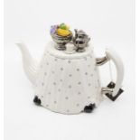 A Cardew china teapot designed by Paul Cardew, the body table shaped with white and blue table