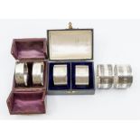 Three pairs of silver napkin rings: cased Georgian style in fitted case, London, 1983; George VI