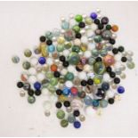 A collection of assorted marbles, various sizes, colours etc