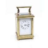 A brass cased carriage clock, the white enamel dial with Roman numerals (hairline cracks to dial),