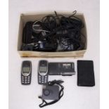 A collection of vintage tech including Nokia phones, micro recorders, cables etc