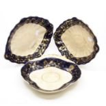 Five early 19th Century Royal Crown Derby bowls, with blue and gilt edging, most items crazed AF,