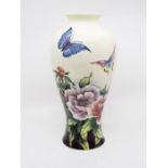 An Old Tupton ware vase, decorated with flowers, boxed