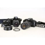 Two early Canon 35mm DSLR's  Featuring:  Canon EOS 5000 75-300mm, 4-5.6  Lens Hood Canon 1000F  28-