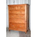 A Victorian pine chest of drawers, comprising two short over four long graduated drawers, most