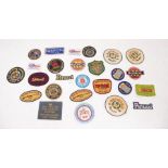 A collection of rifle club and shooting stitch on badges