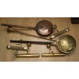 A collection of brass and copper to include: two large warming pans, a French horn and a
