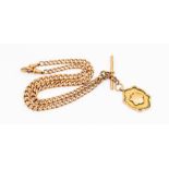 An early 20th century 9c rose gold double Albert link fob chain with suspended medallion fob, T