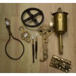 A 19th Century brass wall hanging; bottle jack complete with wall fitting, meat claw and wheel